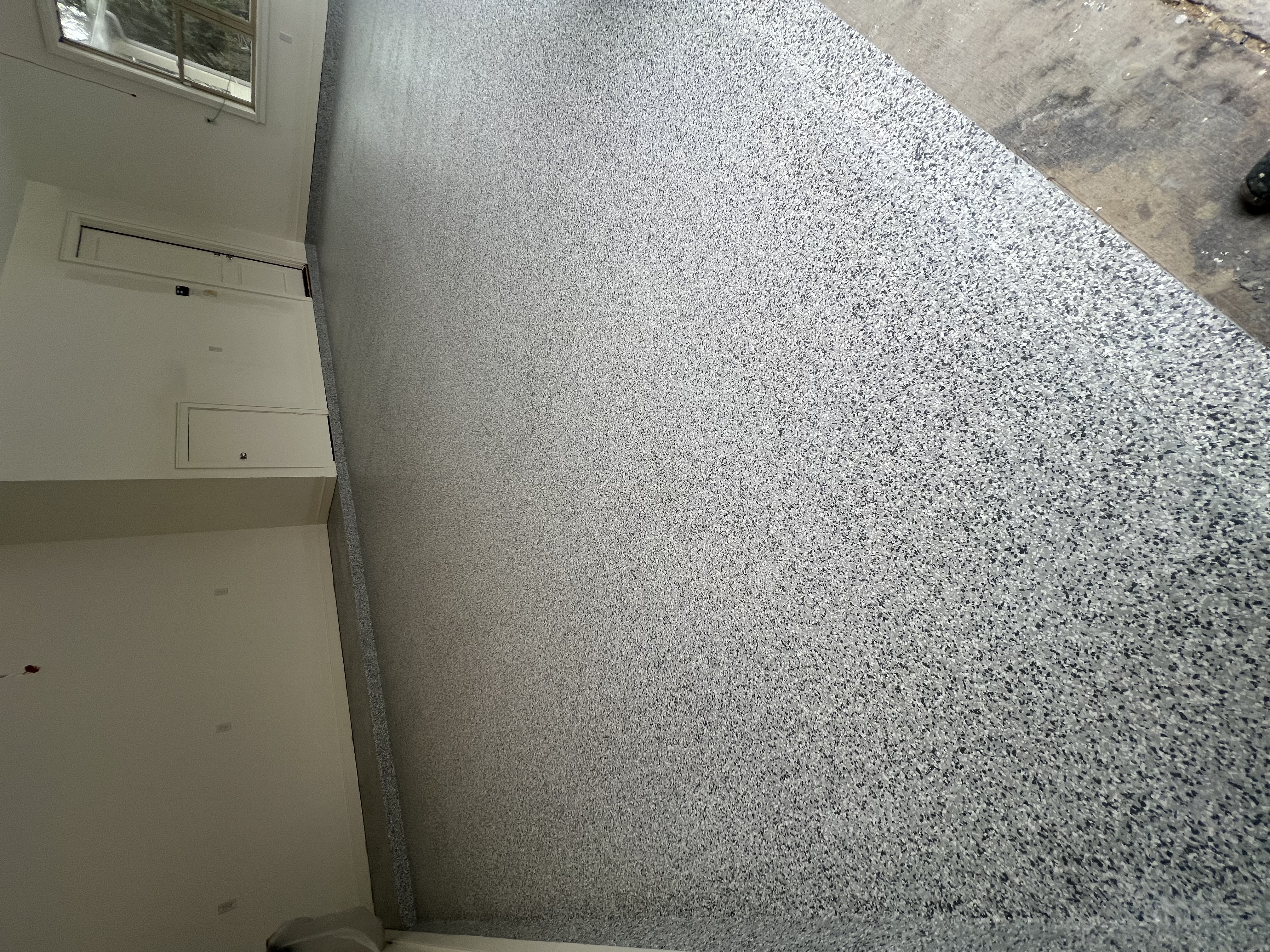 Premium epoxy garage floor by Unico Floor Coatings